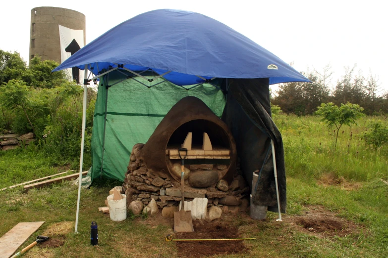 a little camper with a large blue roof