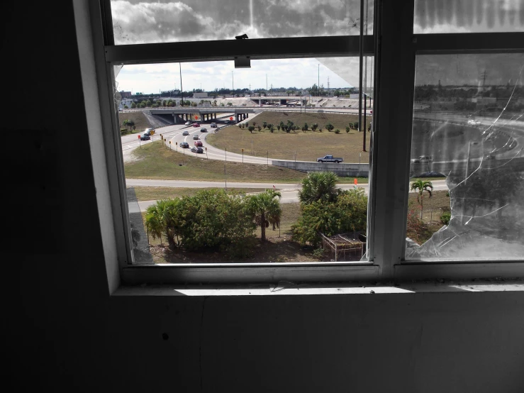 a building is seen through an open window