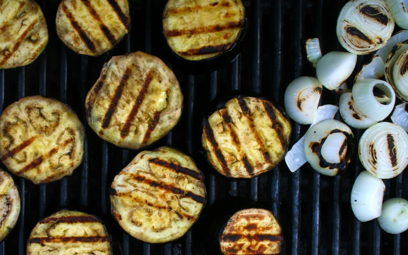 grilled food with onion on top, with more onion behind it