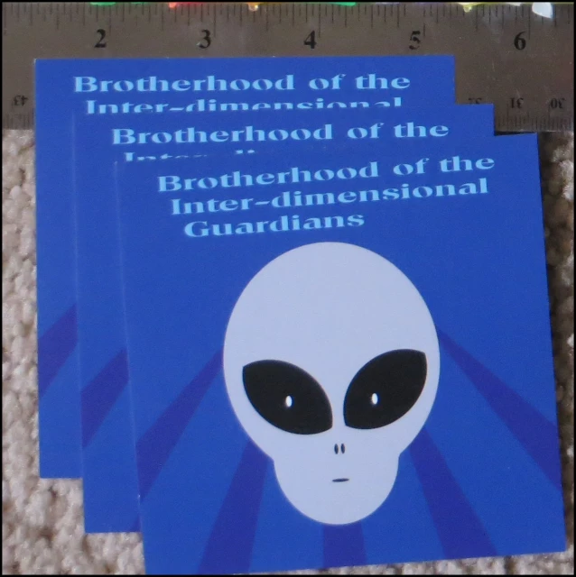 two brochures for the brothershood of the international guardianss, sitting on carpet