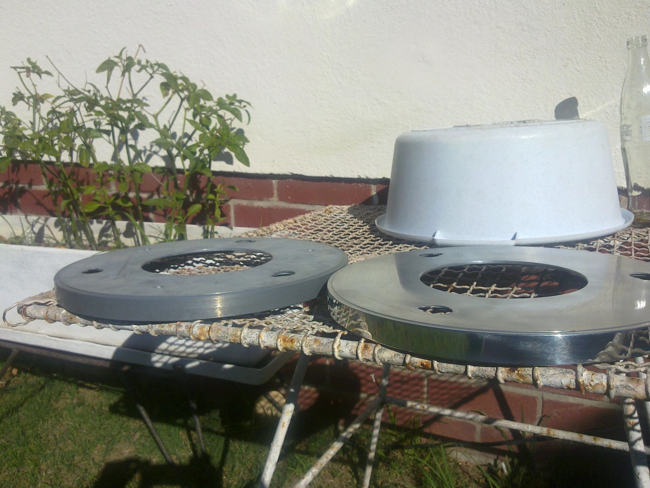 two blow up smokers sit on top of a garden table