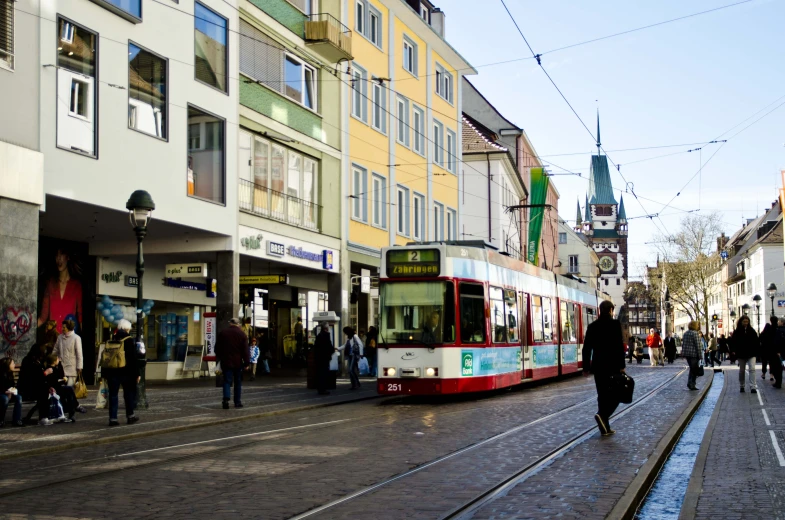 a street scene with a trolley on the road