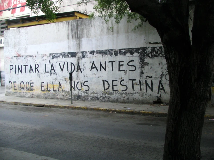 a painting of writing on the side of a building