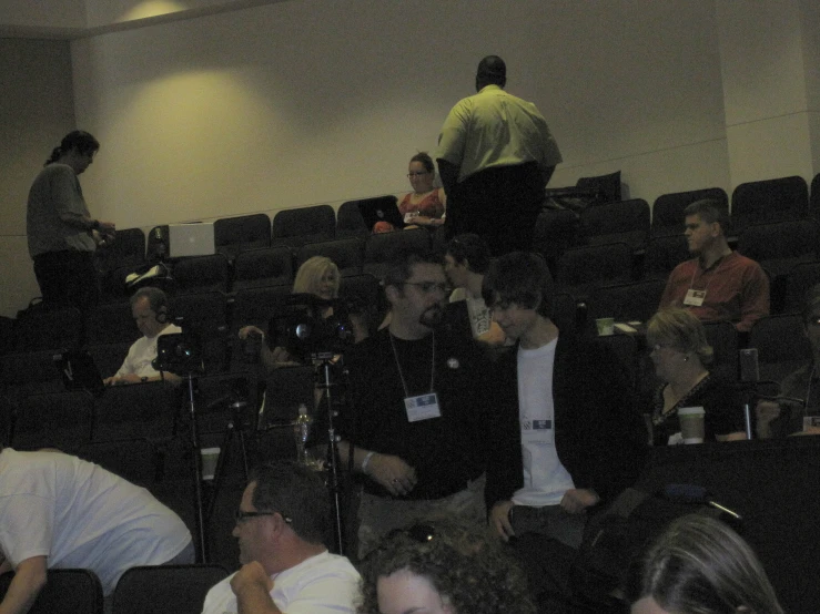 a group of people sitting in a room together