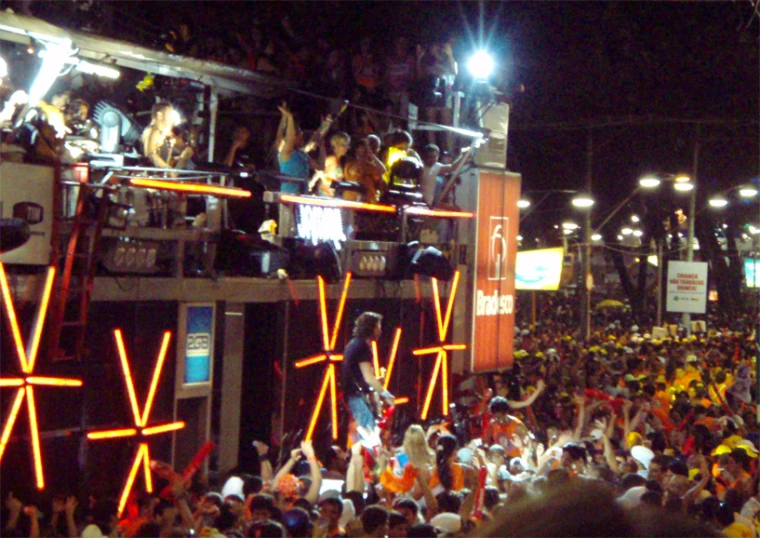 a crowd of people standing on top of a street