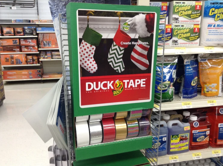 there are two signs on the shelf for duct tape