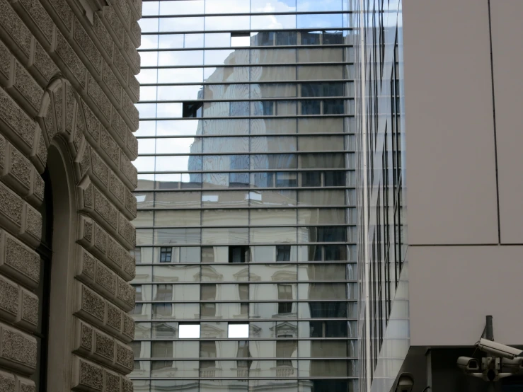 a very tall building seen through some glass windows