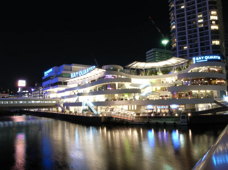 the buildings are brightly lit in the city lights