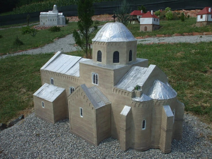 a model of a church made out of cement bricks