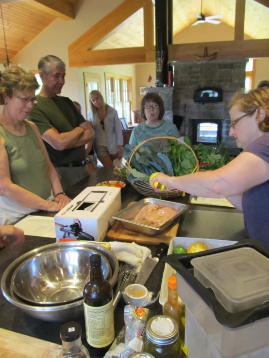 a group of people gathered around a kitchen counter