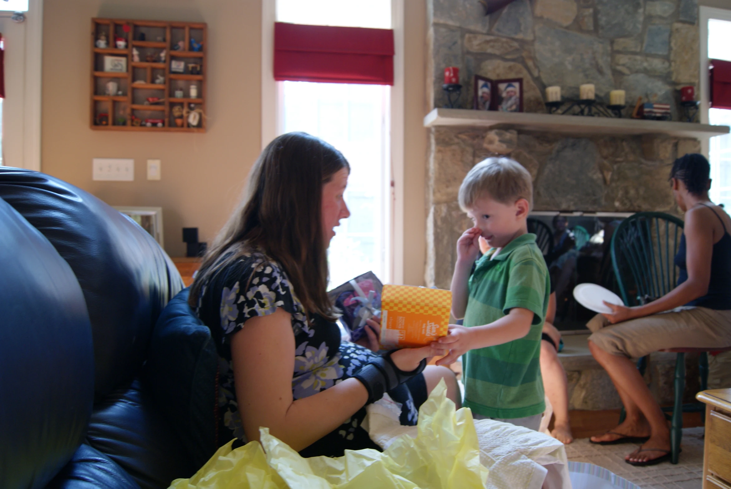 a woman and child holding a frisbee at home