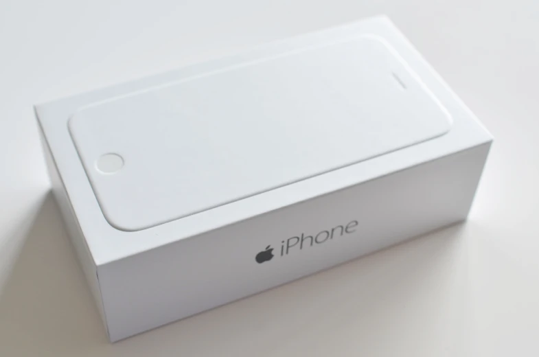 an iphone box that is opened and sitting on a table