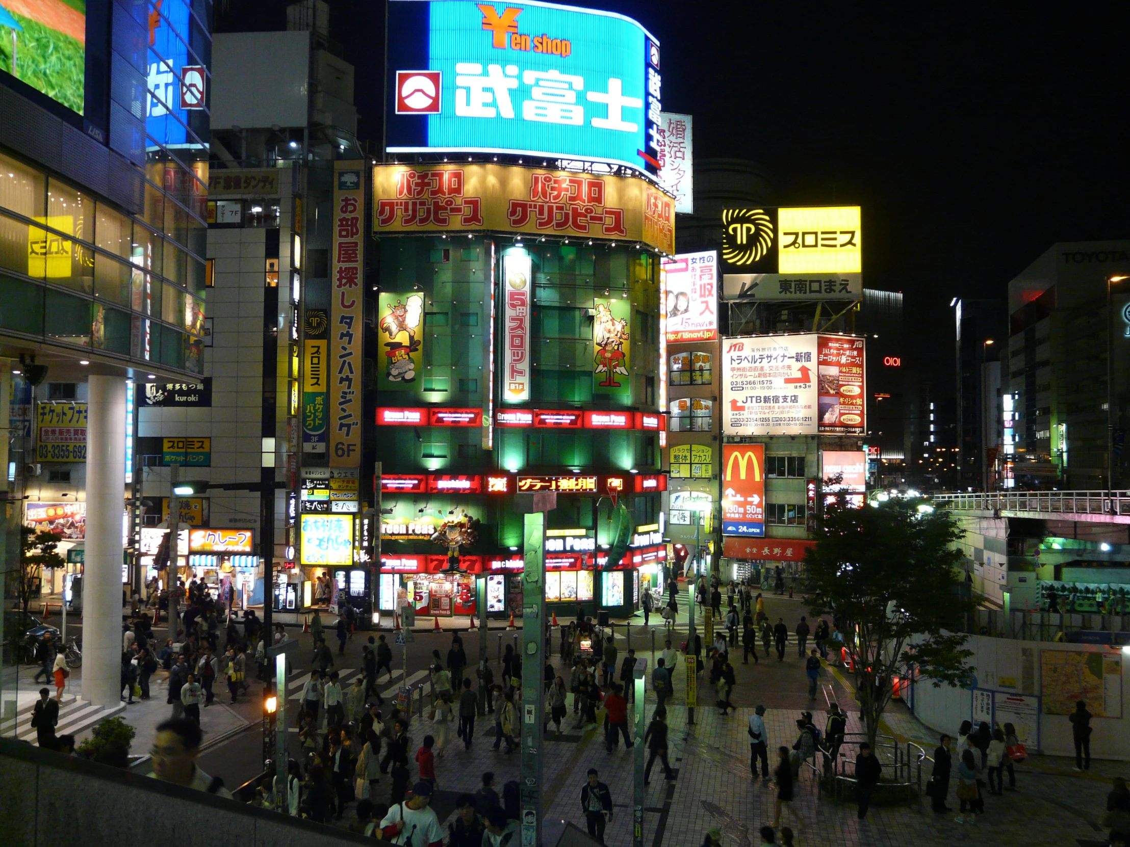 an image of people at night time in a crowded street