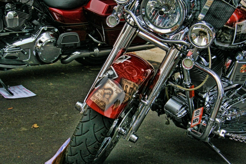 two motorcycles parked side by side on a street