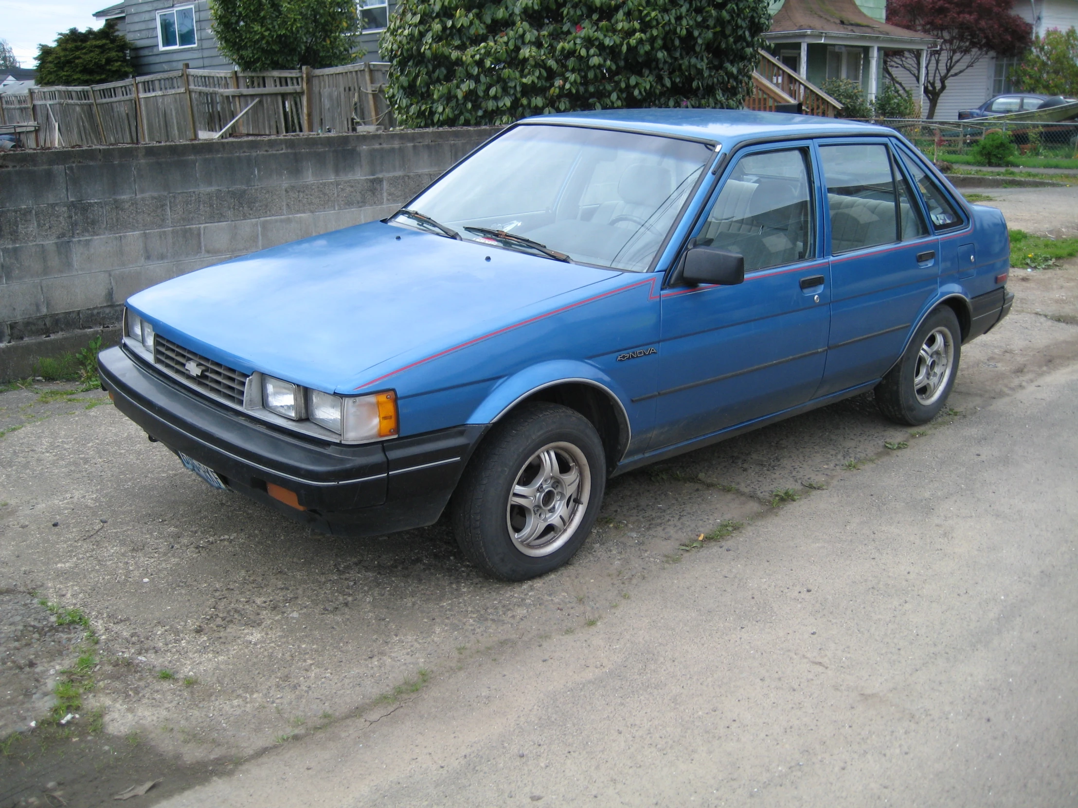 a blue car parked on the road