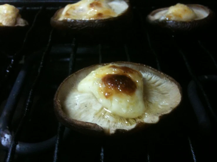 an open oven with some baked goods inside