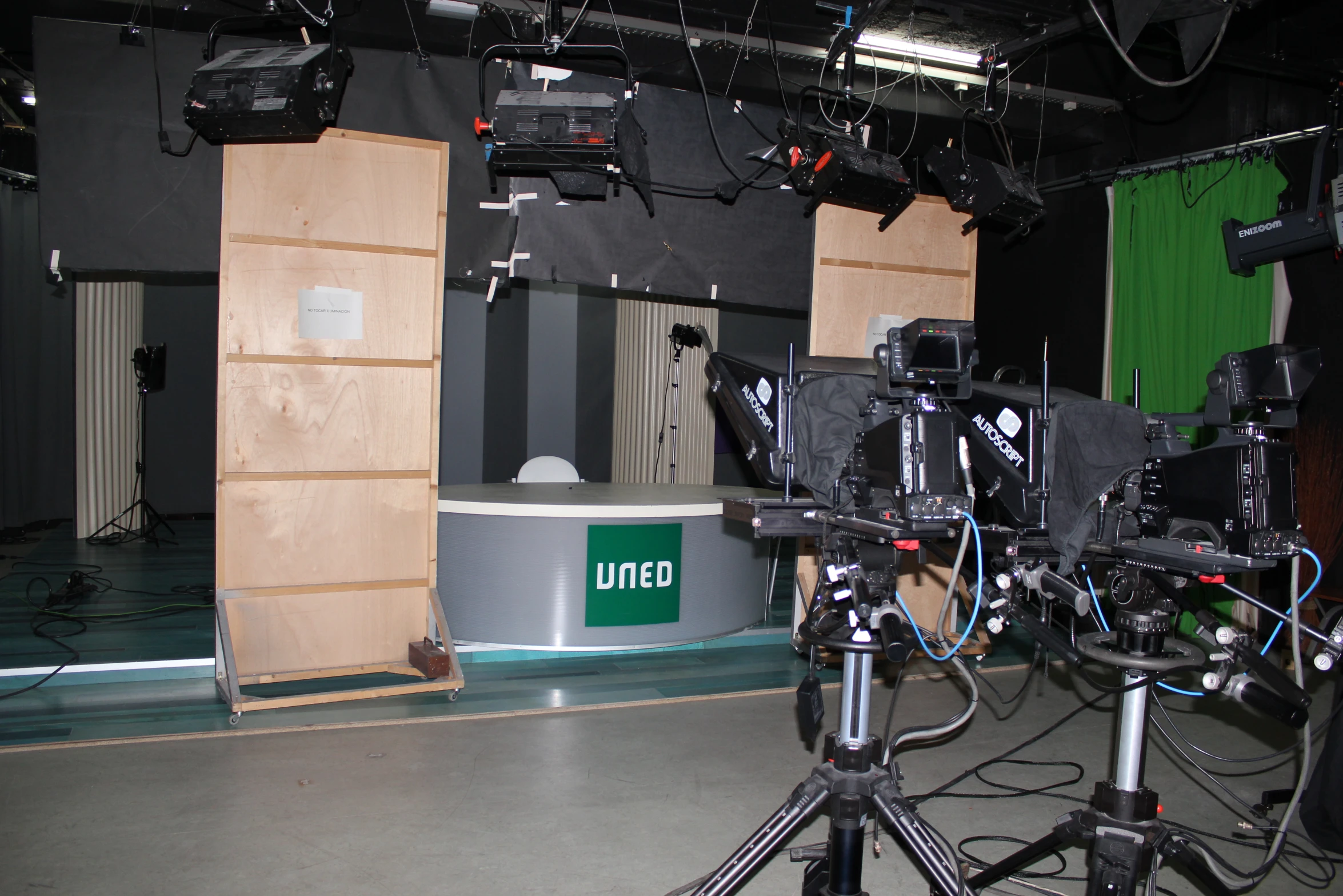 a scene with multiple cameras set up to perform an event