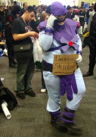 the man is dressed like he has a purple costume