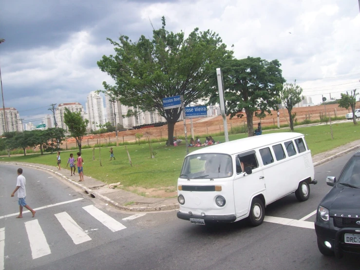 people are walking down the street from a bus