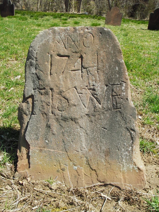 a stone monument with symbols inscribed on it