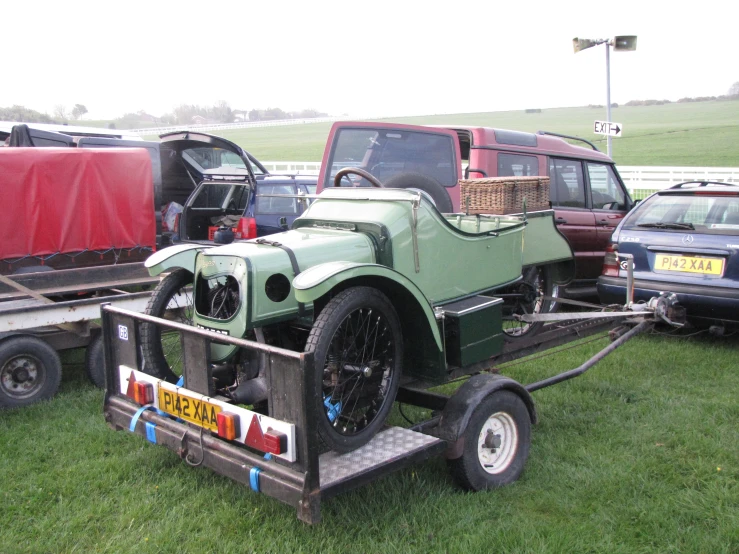 a large truck with a little car attached to it