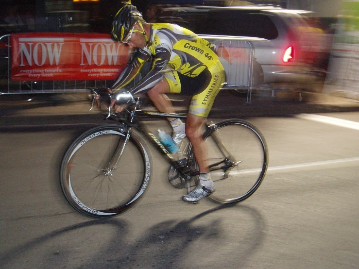 cyclist in bib riding in the middle of the street