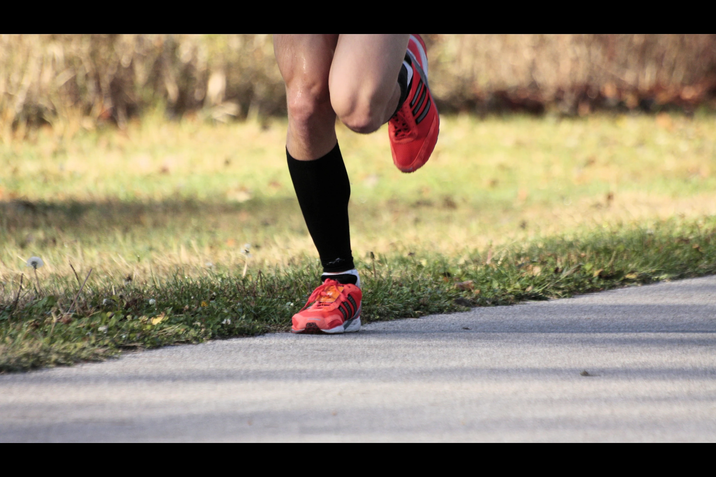 the person is running on the street by himself