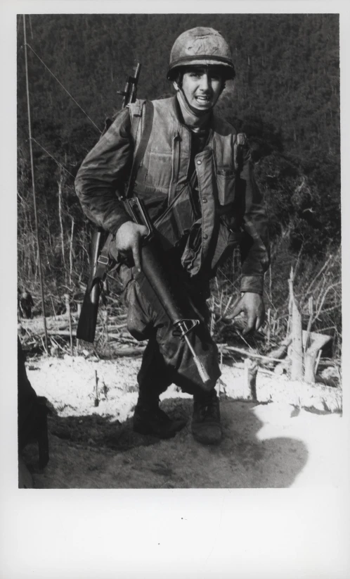 a man standing with an aket in his hands