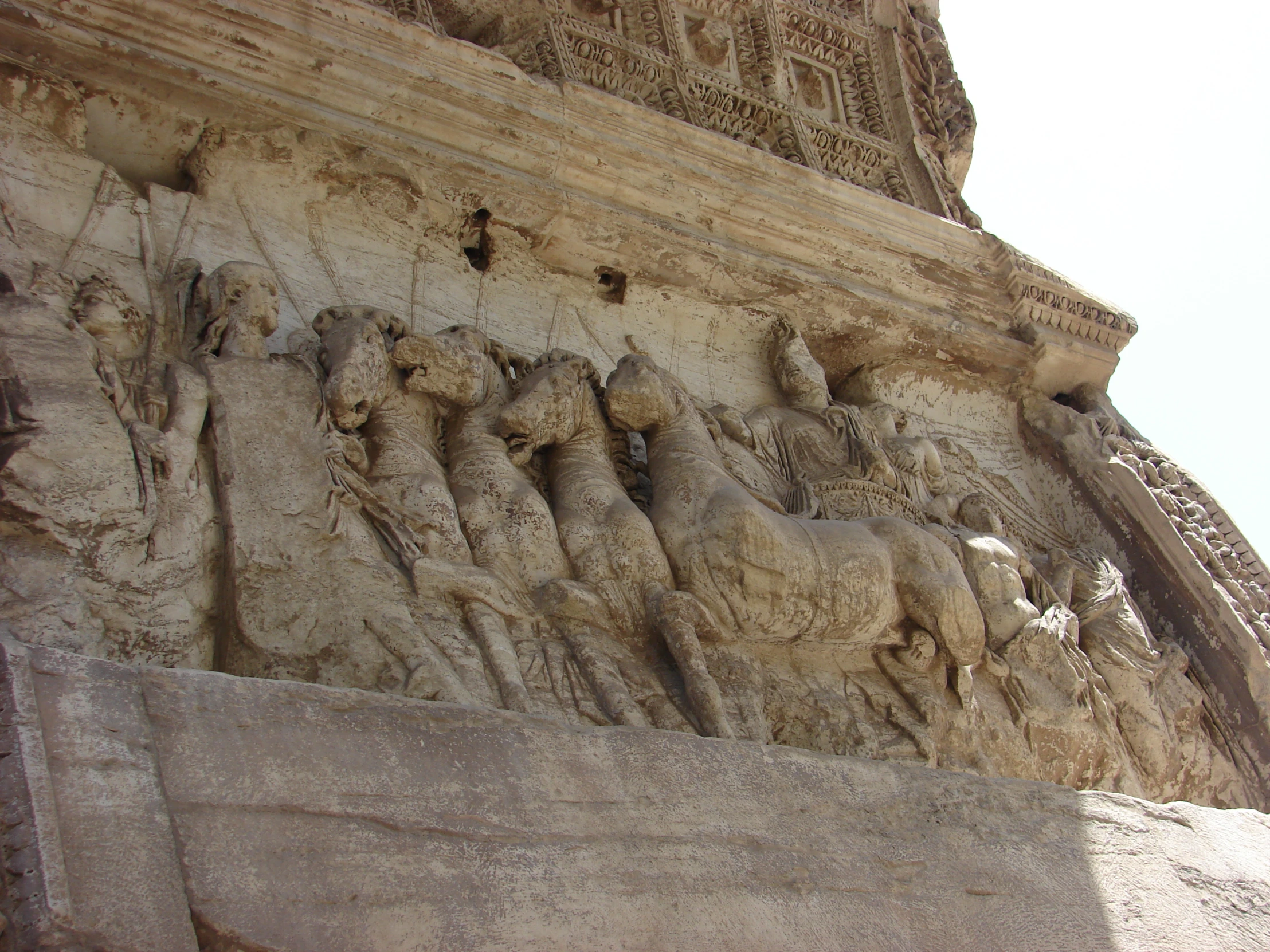 an intricately carved bask is near an ornate building