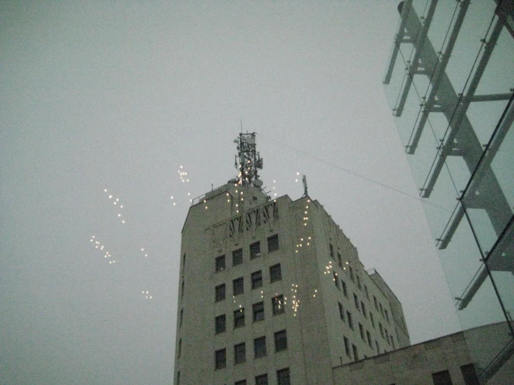 an office building is lighted with christmas lights