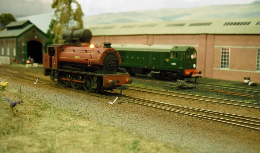 a red train traveling through a rural countryside