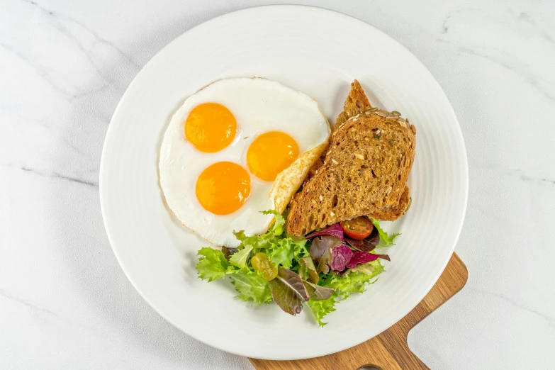 a close up of a plate of food on a table, an egg, artoast8p, sleek white, fan favorite