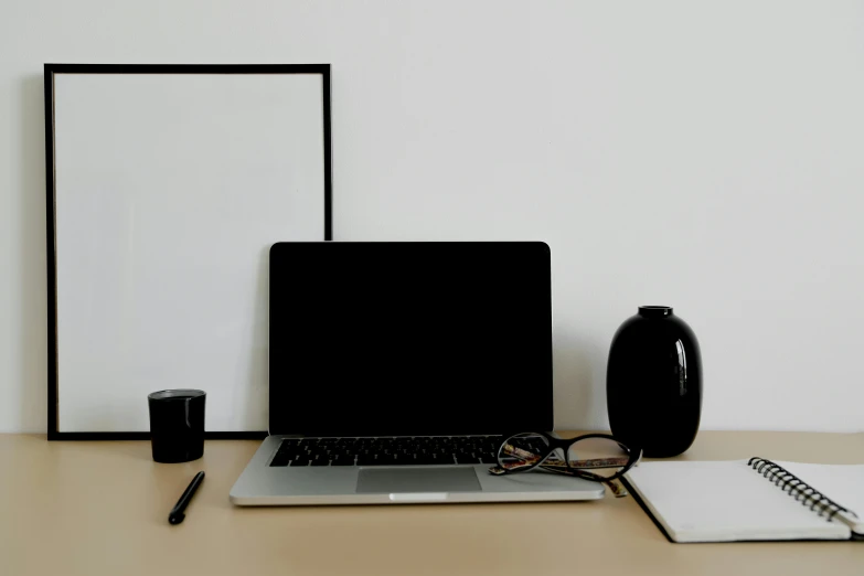 a laptop computer sitting on top of a wooden desk, a computer rendering, pexels, postminimalism, bold black lines, set against a white background, no - text no - logo, with square glasses