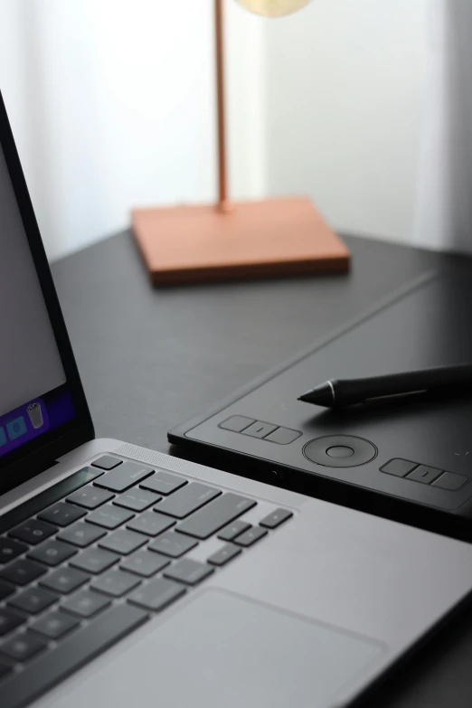 a laptop computer sitting on top of a wooden desk, pexels contest winner, computer art, draw with wacom tablet, all black matte product, in front of a computer, tech demo