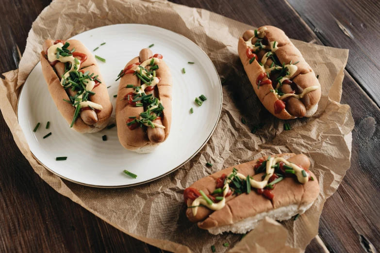 a couple of hot dogs sitting on top of a white plate, unsplash, bauhaus, chinese, in a row, 15081959 21121991 01012000 4k, loaves