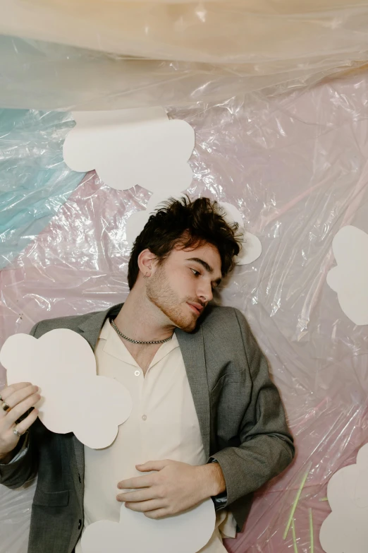 a couple of men standing next to each other, an album cover, by Adam Dario Keel, trending on pexels, sitting in a fluffy cloud, daniel radcliffe, cut out, in his suit