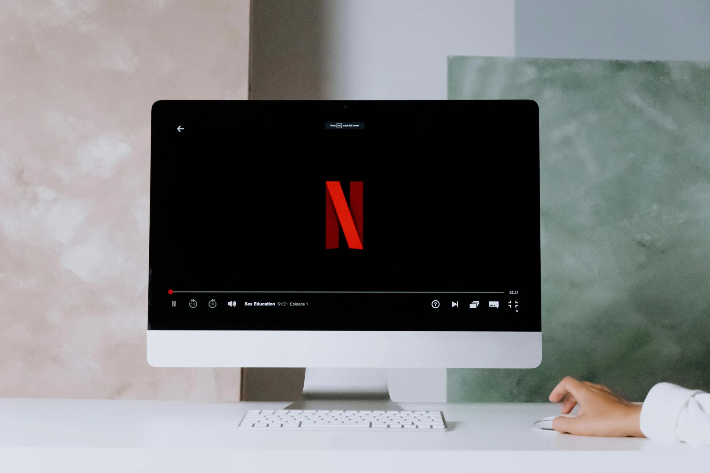 a person sitting at a desk in front of a computer, trending on pexels, art nouveau, at netflix, vertical orientation, glossy surface, part of the screen