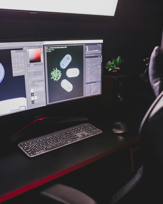 a man sitting at a desk in front of a computer, living spore microorganisms, lgbtq, dark setup, nanotechnology