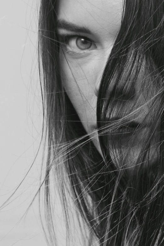 a black and white photo of a woman with long hair, pexels contest winner, hyperrealism, face partially obscured, half face, like a catalog photograph, hair over face