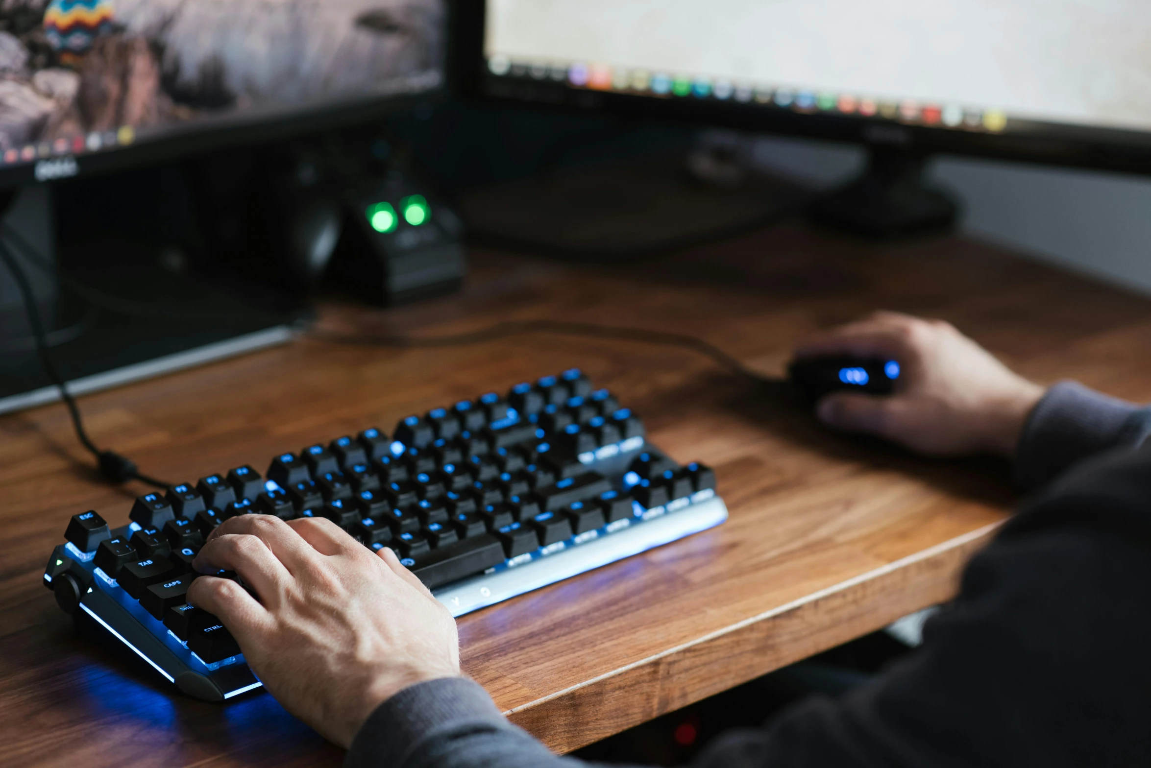 a man is typing on a computer keyboard, a computer rendering, by Dan Content, unsplash, gaming pc, background image, roleplaying, on a wooden desk