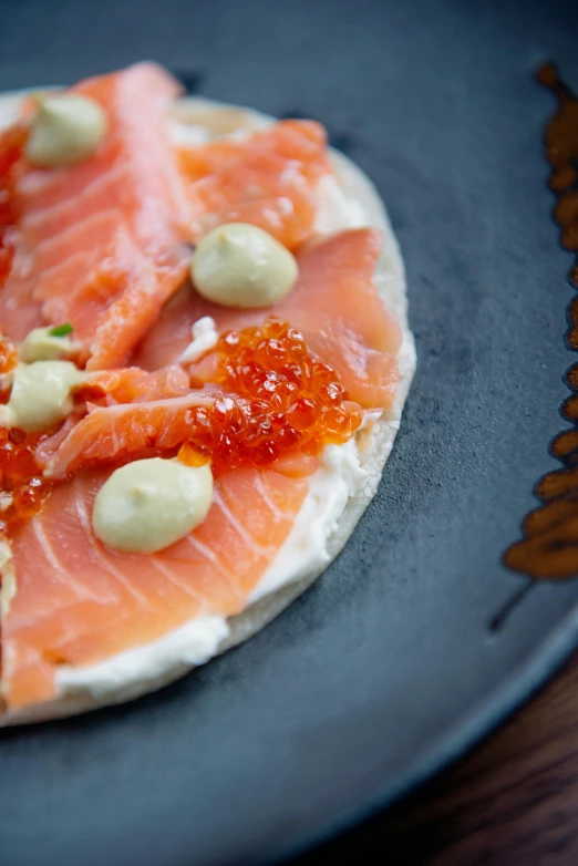 a close up of a plate of food on a table, by Tom Scott RSA, salmon khoshroo, brood spreading, cross hatch, cream