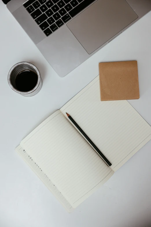 a laptop computer sitting on top of a white table, a drawing, unsplash, black and brown, square lines, vanilla, product shot