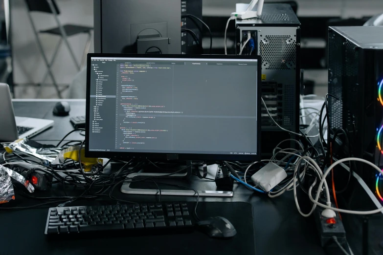 a desktop computer sitting on top of a desk, unsplash, complicated circuits and wires, stacked computer screens, developers, unedited