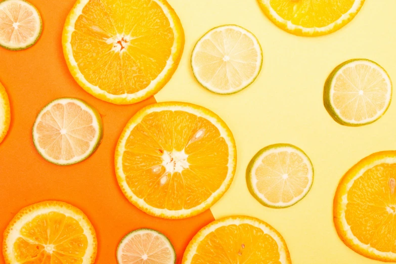 sliced oranges and limes on a yellow background, by Carey Morris, trending on pexels, background image, skincare, orange mist, neon vibes