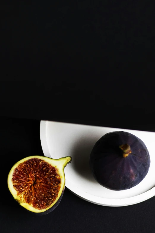 a fig sitting on top of a white plate, inspired by Caravaggio, trending on unsplash, dark purple, bright on black, an alien fruit, sleek round shapes