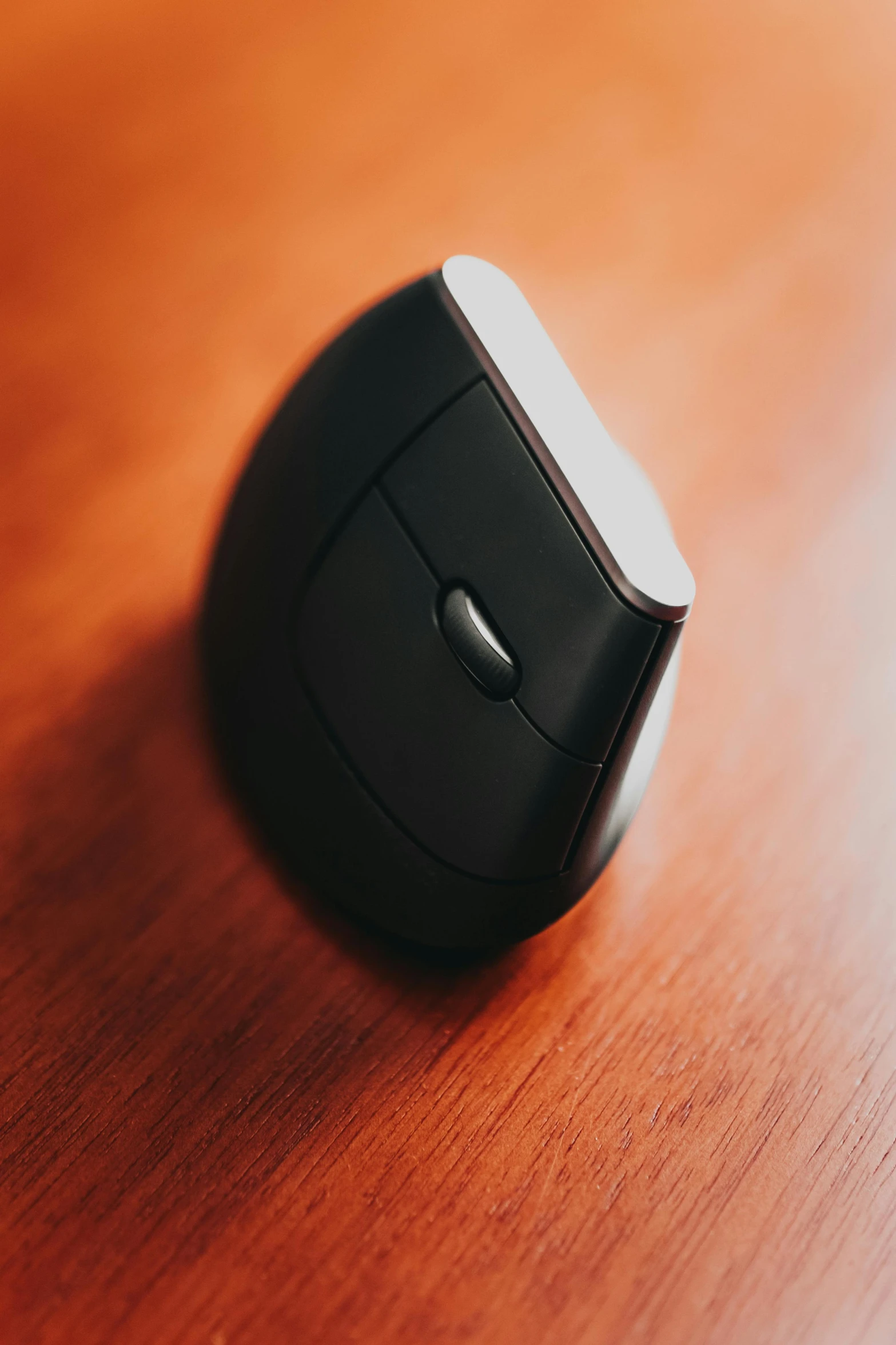 a computer mouse sitting on top of a wooden table, product image, half turned around, f / 2 0, square