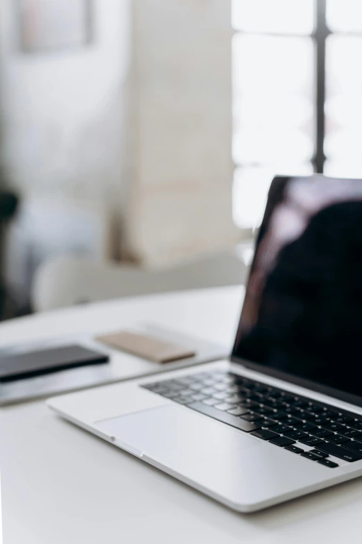 a laptop computer sitting on top of a white desk, by Carey Morris, trending on unsplash, multiple stories, dynamic closeup, recognizable, online