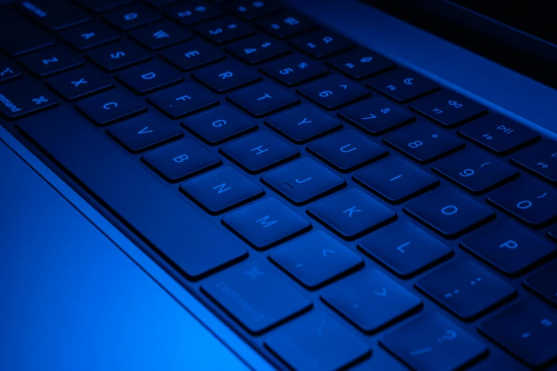 a close up of a keyboard on a laptop, a computer rendering, by Carey Morris, pexels, blue neon, 15081959 21121991 01012000 4k, bottom angle, getty images