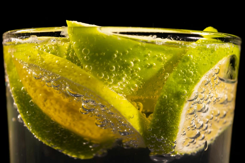 a glass of water with lime slices in it, by Adam Marczyński, pexels, photorealism, sparkling dew, dynamic closeup, promo image, thumbnail