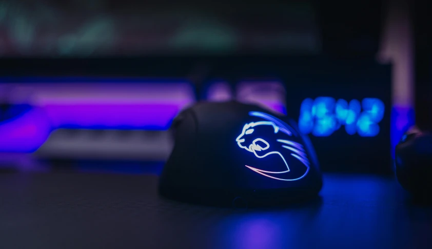 a close up of a mouse on a desk, a hologram, trending on pexels, e-sport style, the smooth black lioness, team ibuypower, discord profile picture